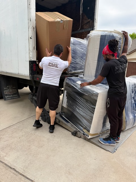Playhouse Moving crew loading a truck for an Austin move